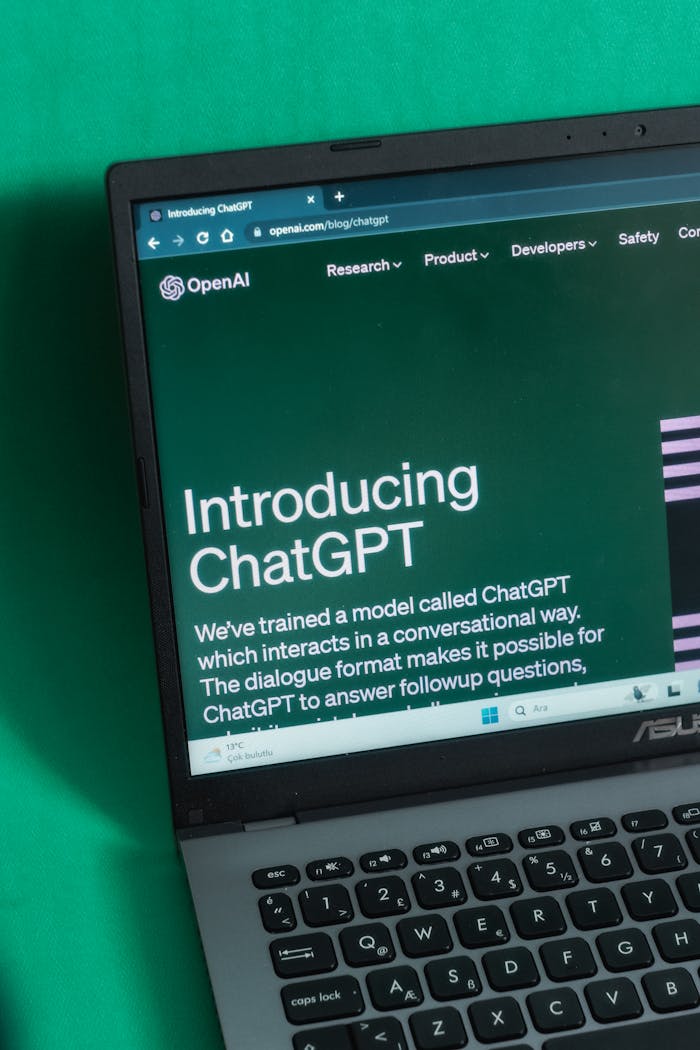 Laptop screen displaying the introductory page of ChatGPT on OpenAI's website.